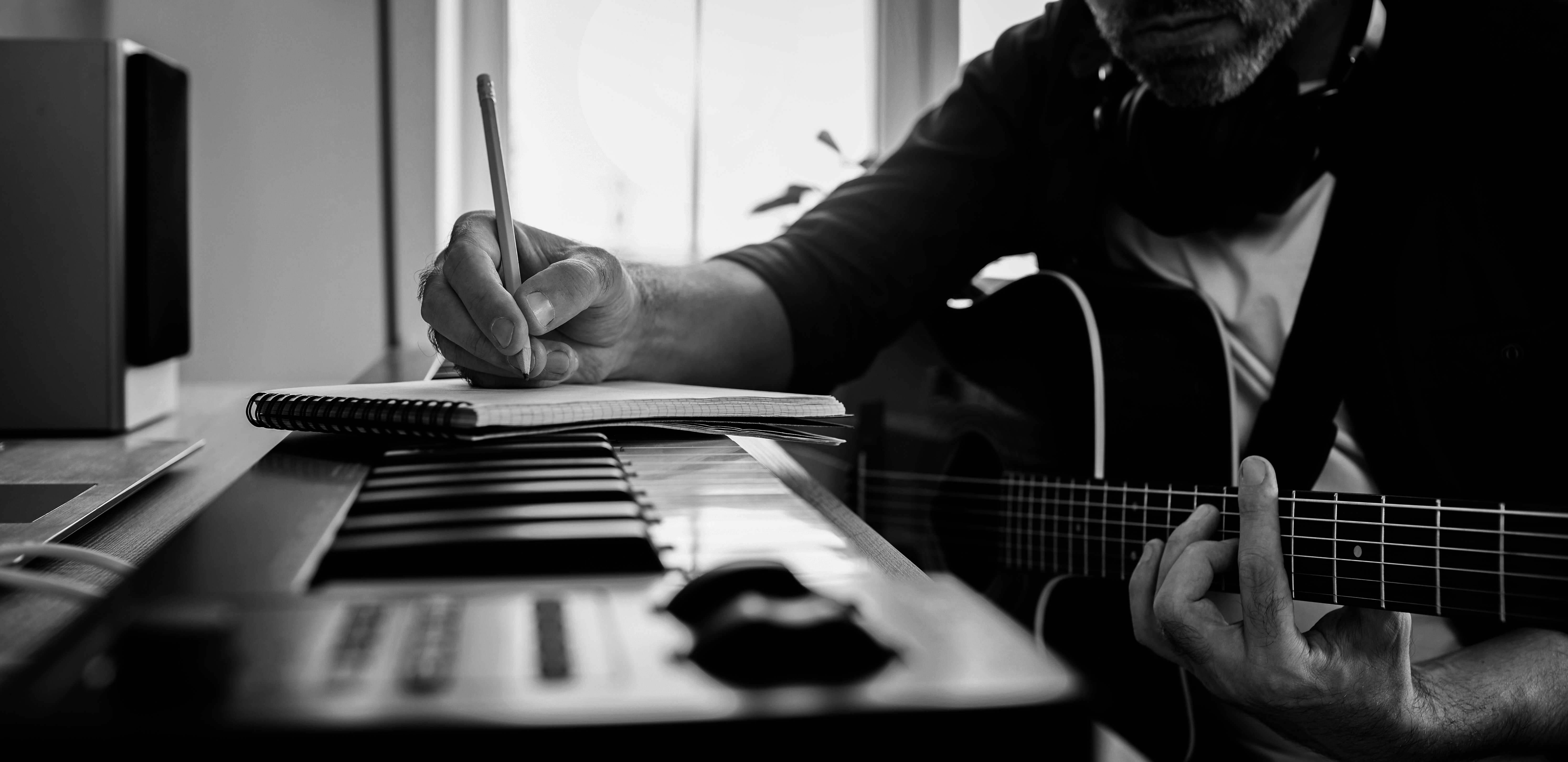  writing music at piano 